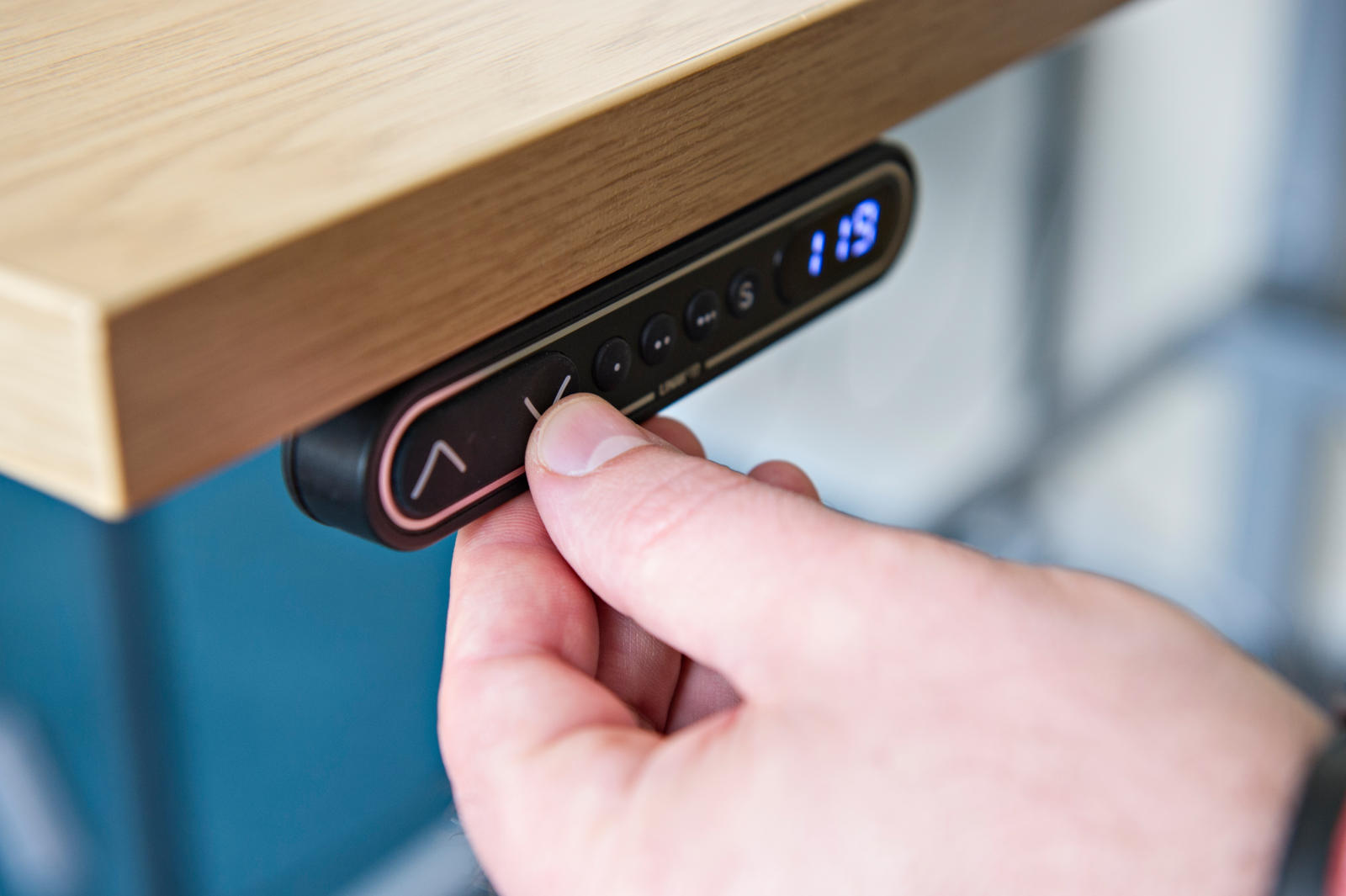 Operating controls on a standing desk